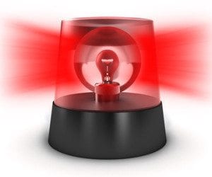 Red flashing light on a white background